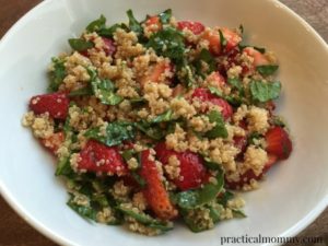 Strawberry and quinoa salad in white ceramic dish