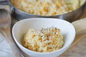 Butternut Squash Risotto in white serving bowl on cutting board