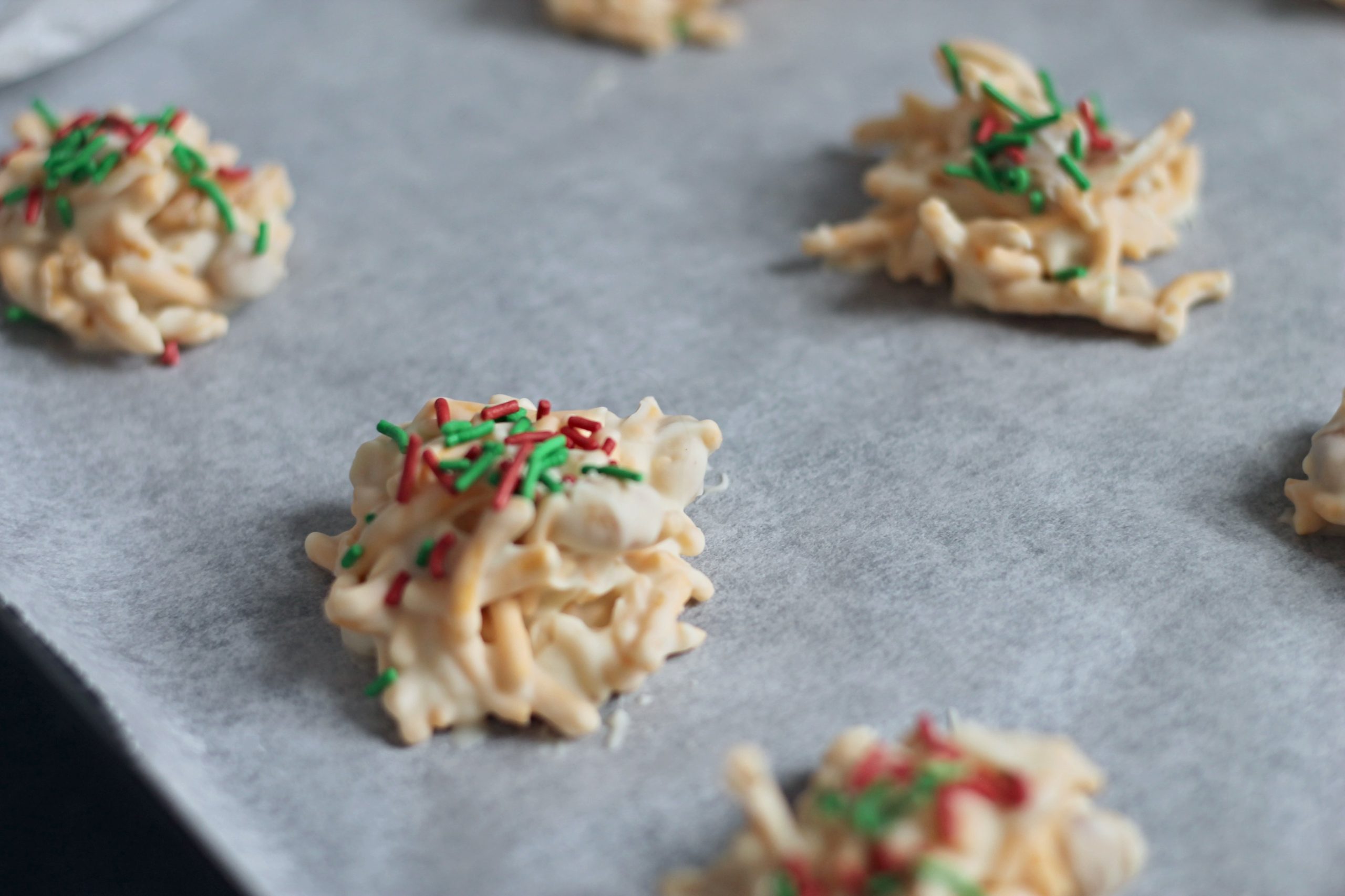 Close Up picture of our White Chocolate Haystack Recipe - Cookies on a Baking Sheet