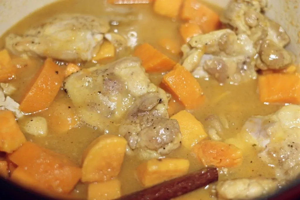 Chicken Stew boiling in Dutch oven