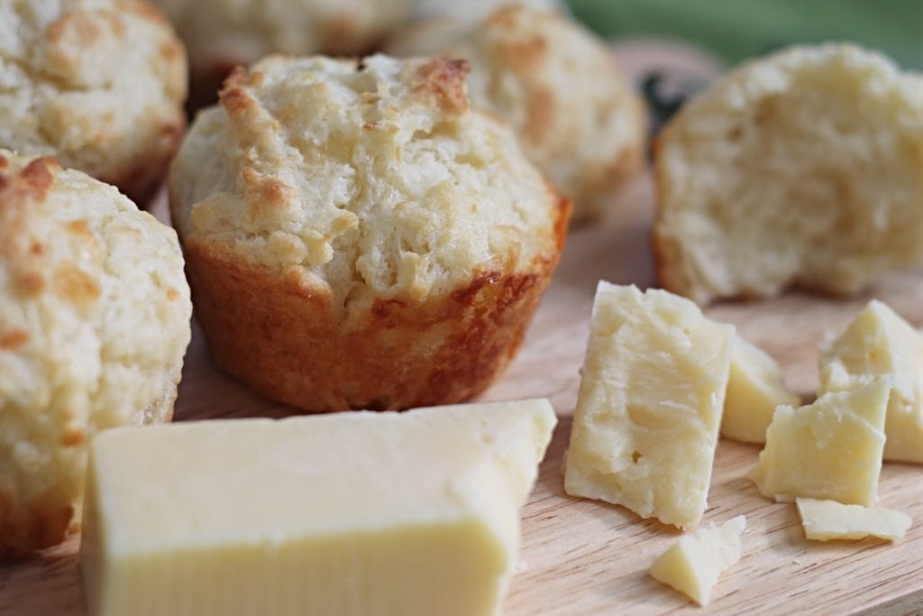 Soda Bread Muffins on cutting board with Irish Cheddar chunks