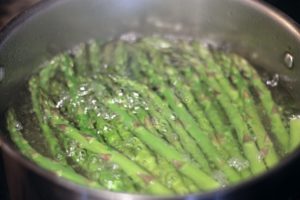 Asparagus spears in boiling water 