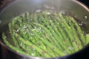 Asparagus spears in boiling water 