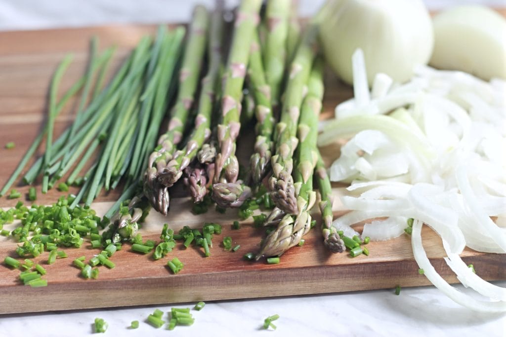 Fresh asparagus and chives with onions for tart