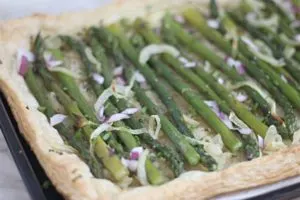 Finished asparagus tart with golden brown pastry 