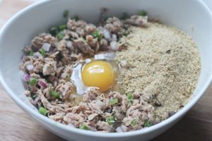 Tuna and mix ins for fish cakes in white bowl 