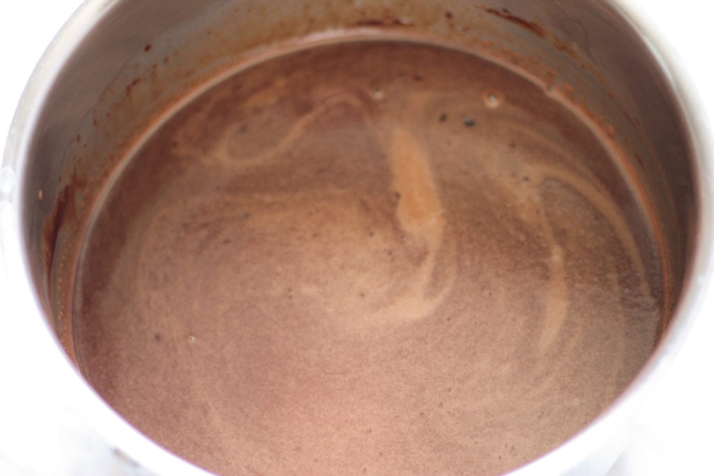 Stainless steel pot with melted chocolate syrup mixture 