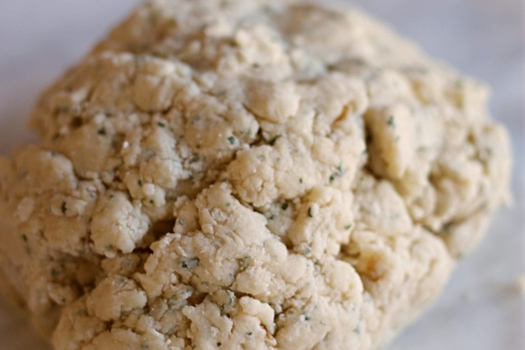 Dough ball for cheese scones on countertop. 