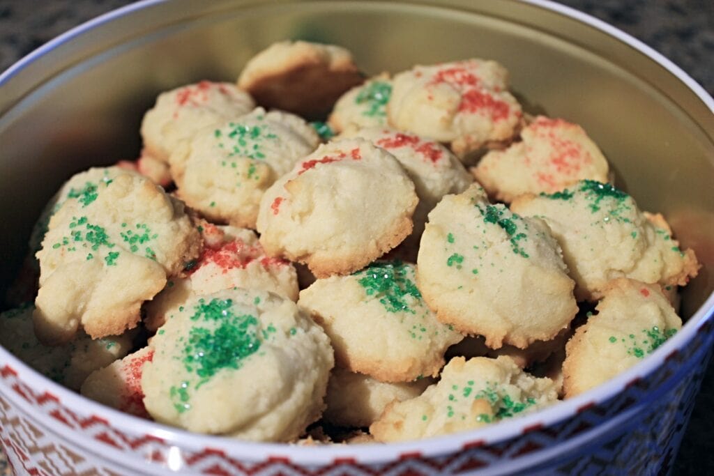 Christmas tin filled with whipped shortbread cookies. 