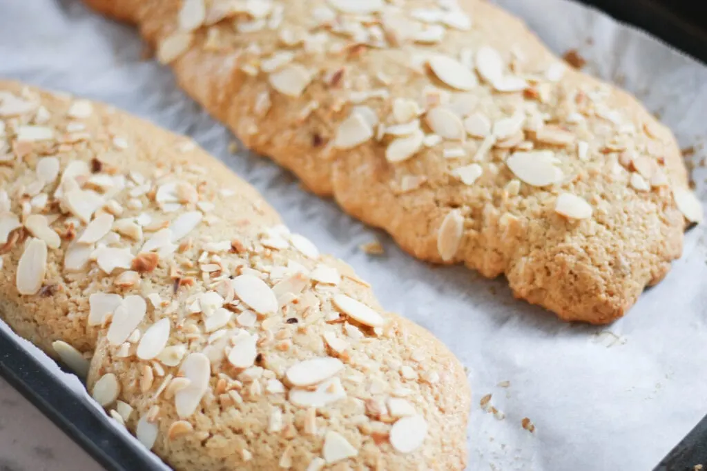 Biscotti logs on baking sheet after first bake.