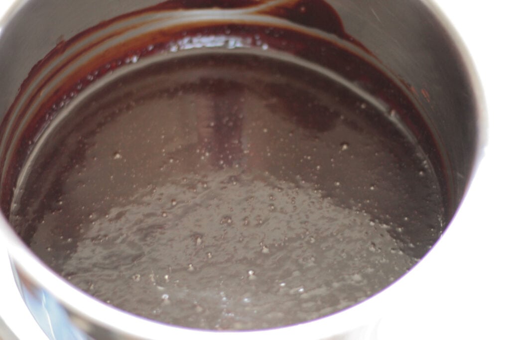 Fully melted chocolate syrup mixture in saucepot